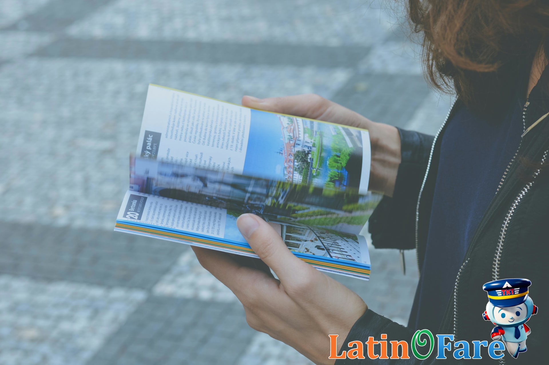 Traveler preparing for stopover trip with guidebooks and luggage at airport terminal