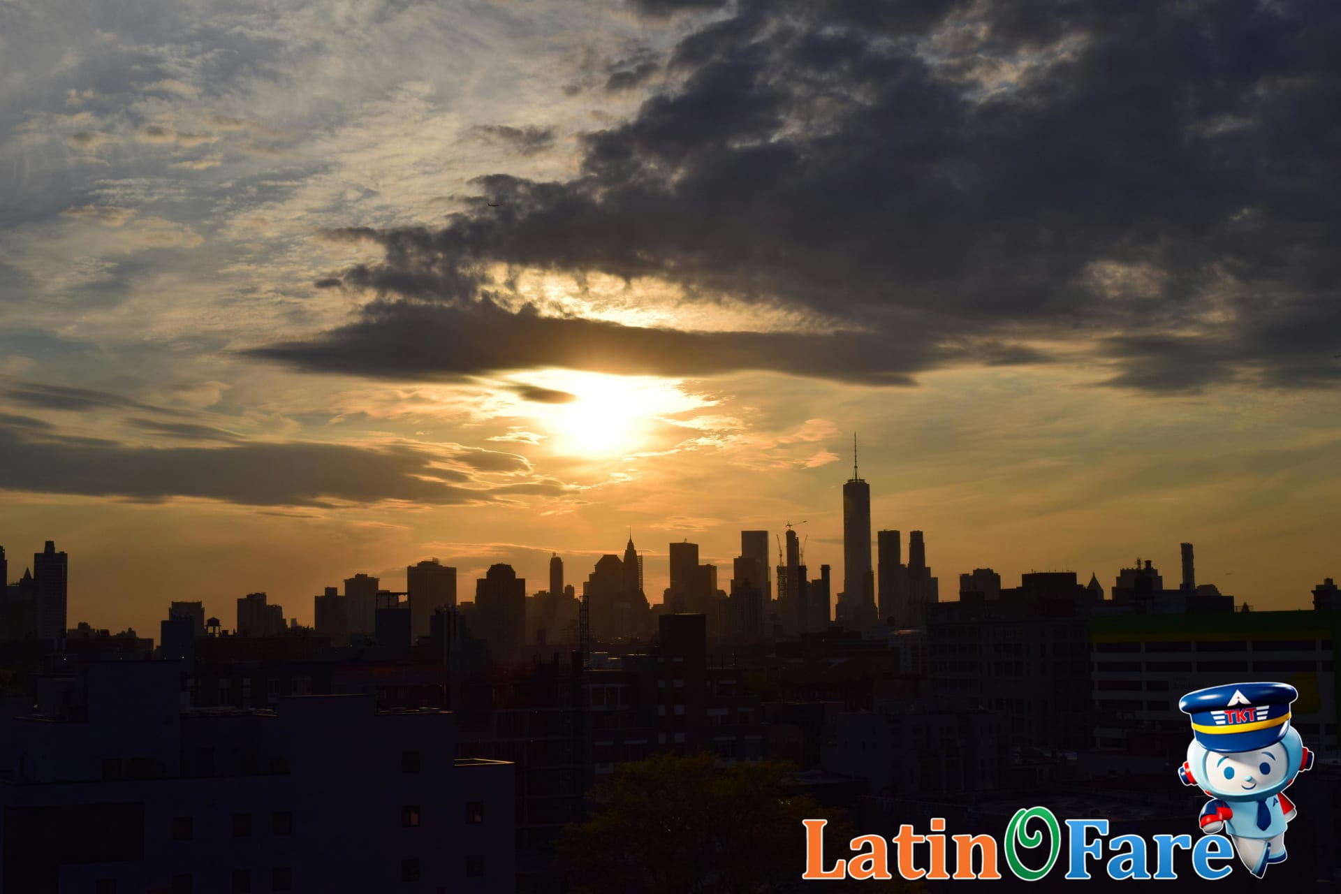 Manhattan skyline at sunset glowing over New York City budget guide.