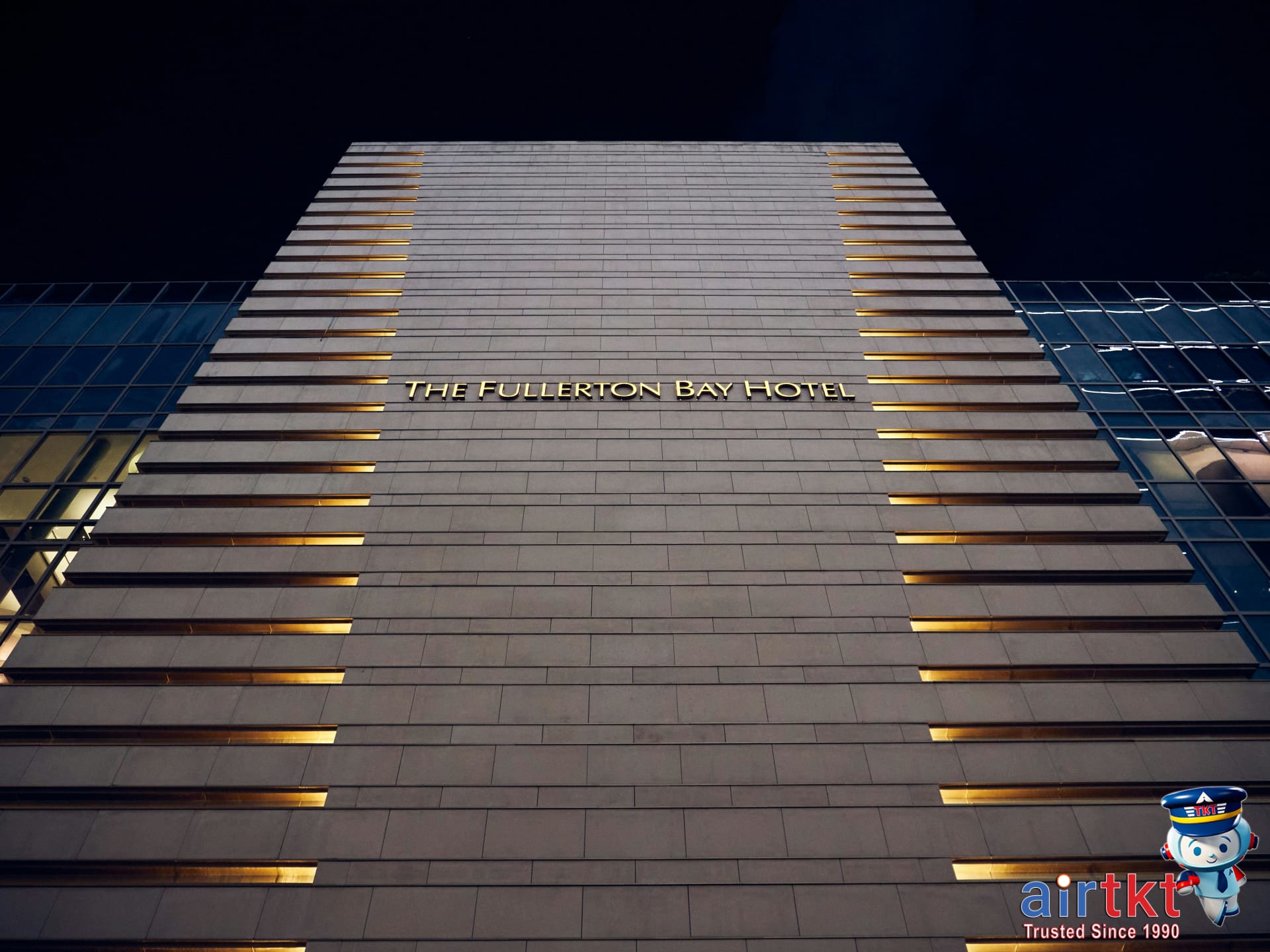 Night view of modern hotel exterior emphasizing guest security measures