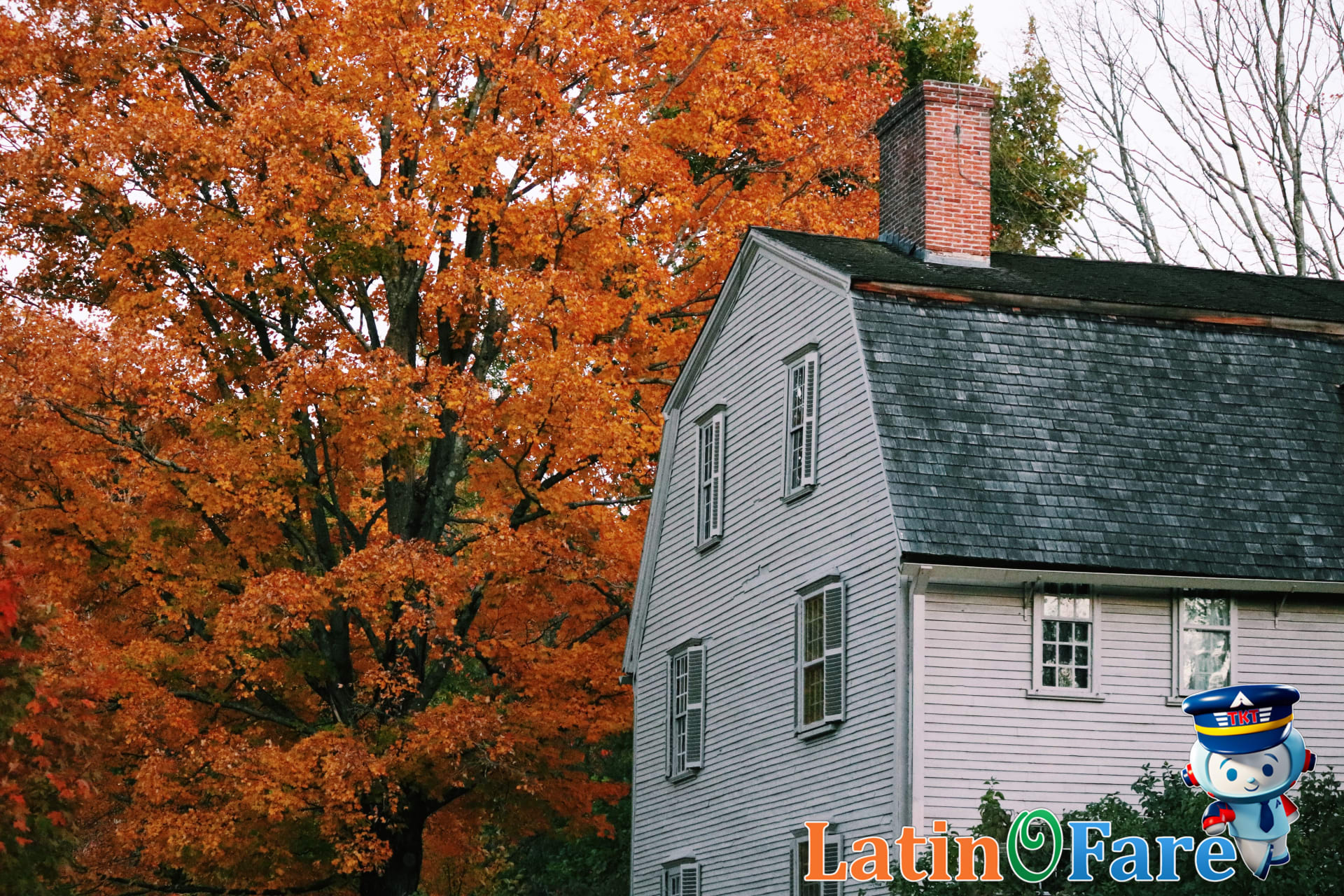 Classic New England inn in front of scenic fall foliage, prime spot for leaf-peeping stays.