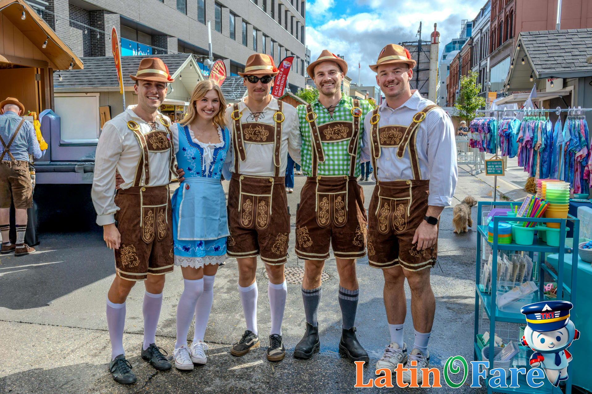 Travelers in authentic lederhosen and dirndls enjoying Oktoberfest Munich traditions