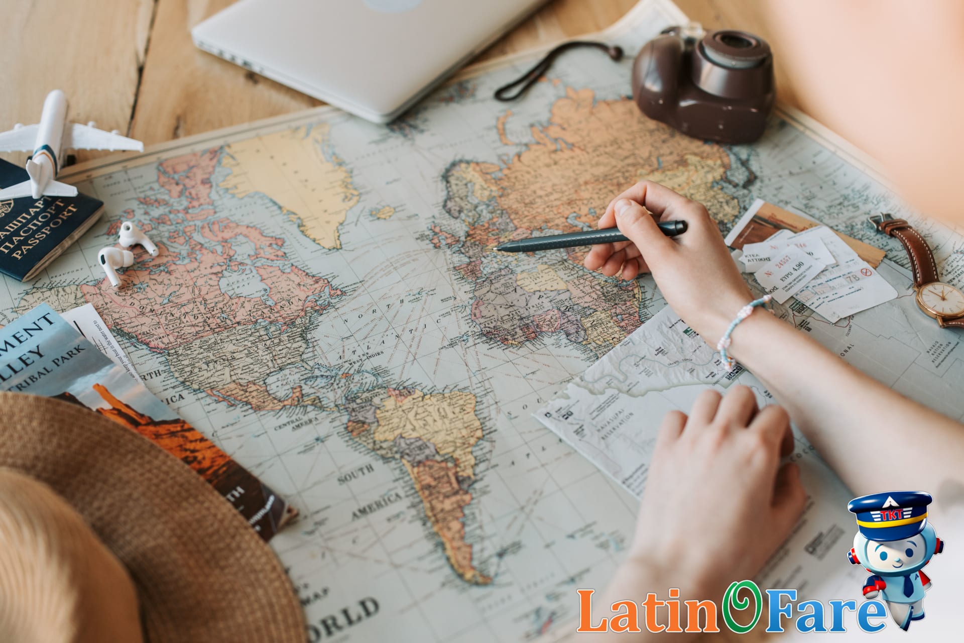 Family checks guidebook and map to budget travel and avoid tourist scams during their trip.