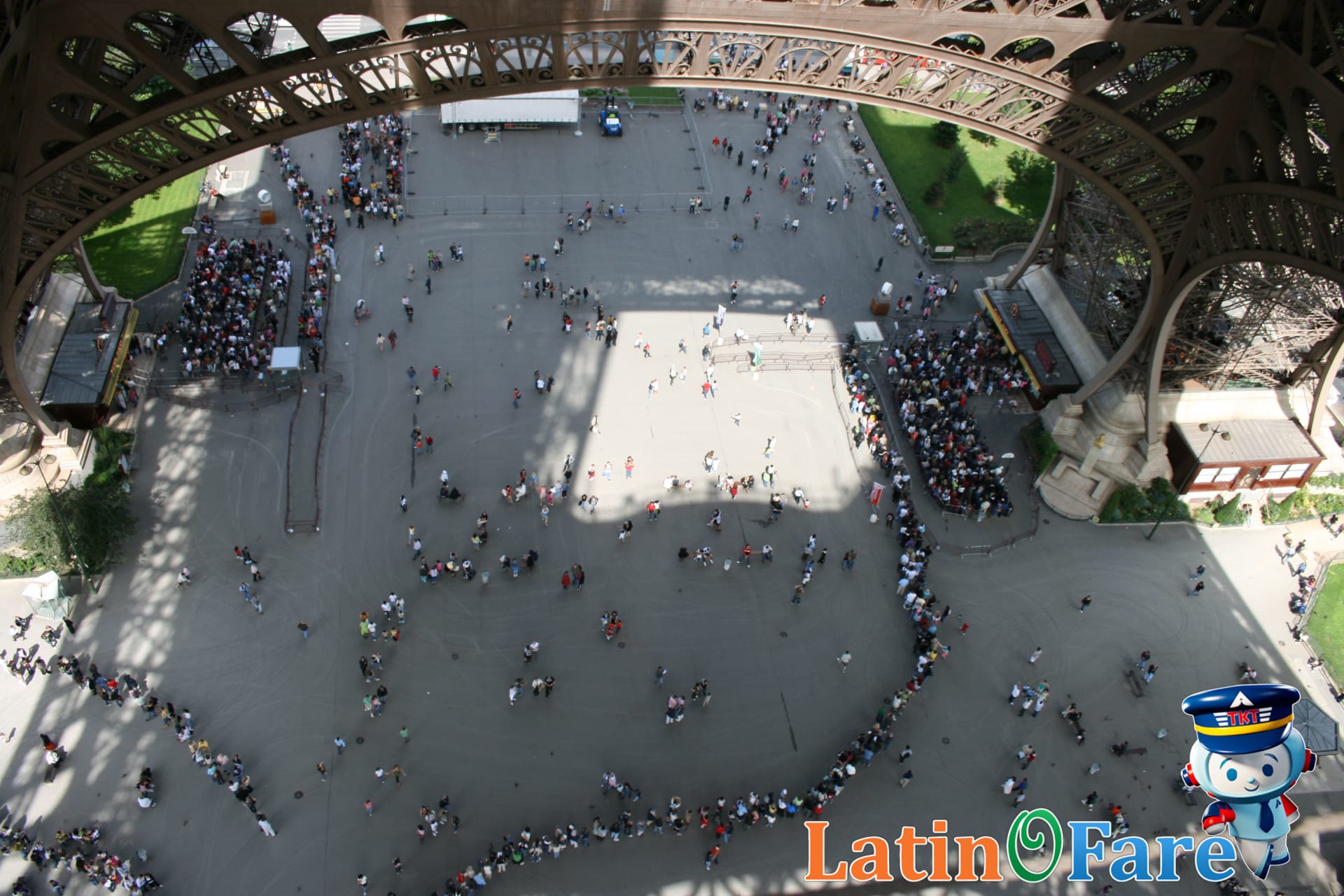 Tourists wait outside an overhyped tourist trap, experiencing inflated prices and crowds.