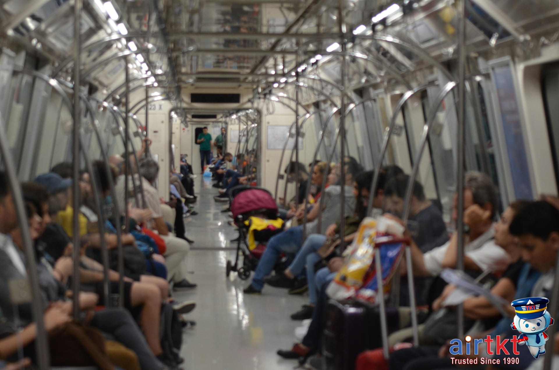 Santiago Metro train with passengers traveling through the city during daytime