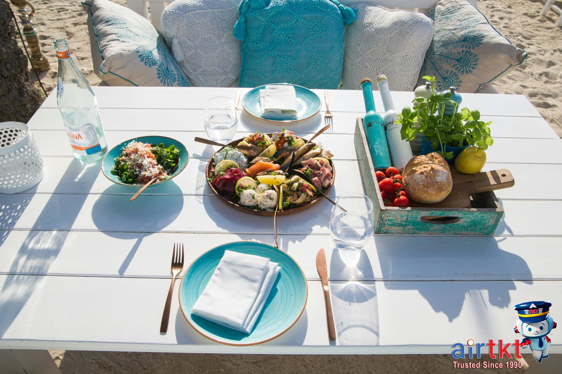 Outdoor beachside table with fresh seafood and vegetables in Cape Cod