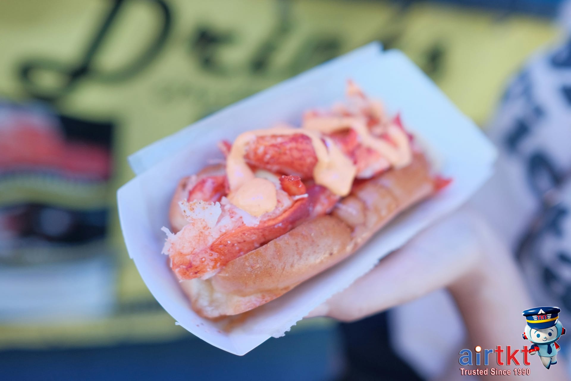 Fresh lobster roll on paper plate at Cape Cod seafood shack