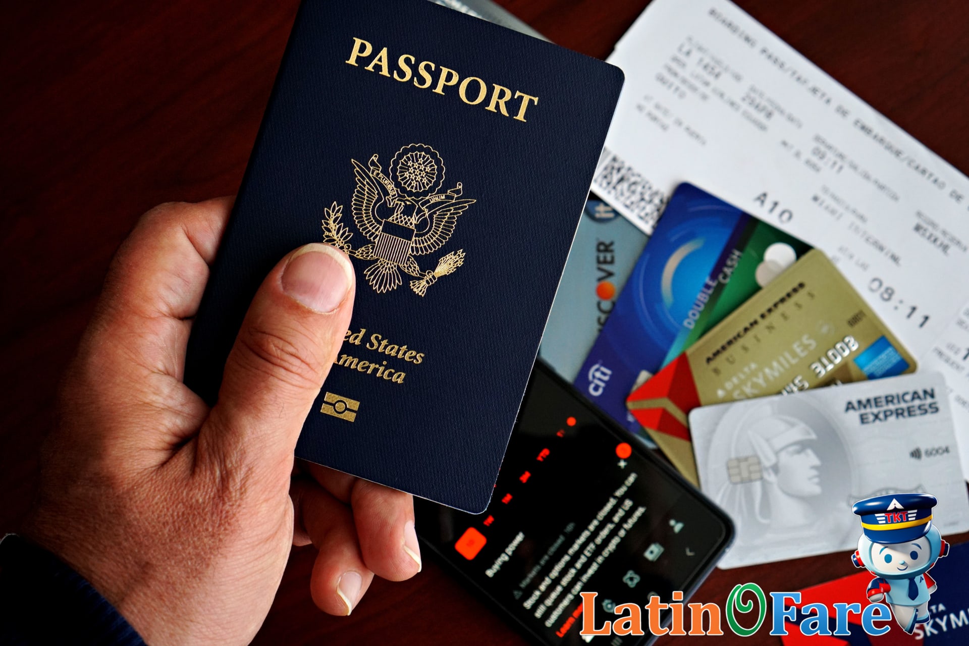 Close-up of hands with tickets from budget and full-service airlines for travel cost checklist.