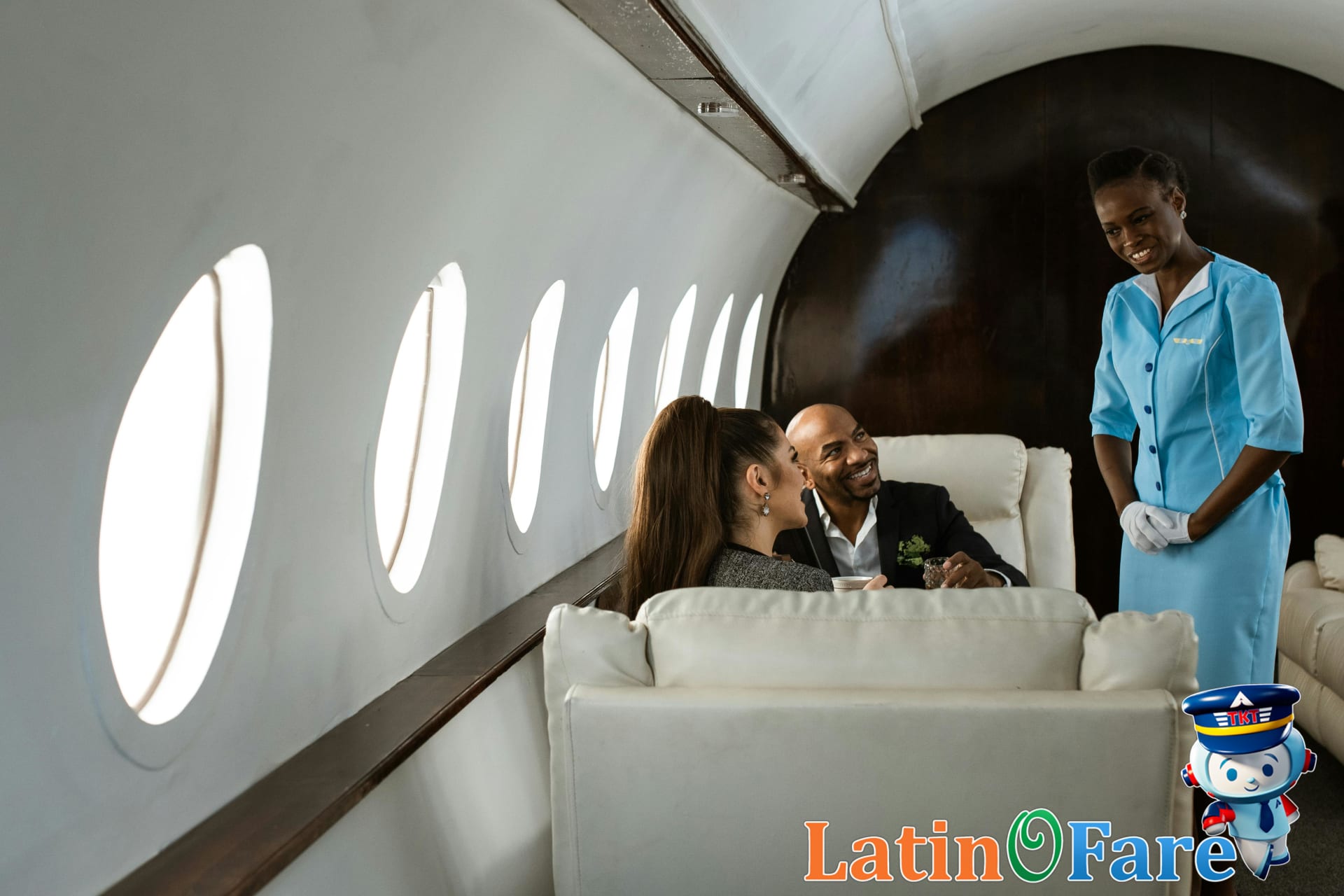 Flight attendants serving complimentary meals and drinks in a full-service airline cabin for travelers.