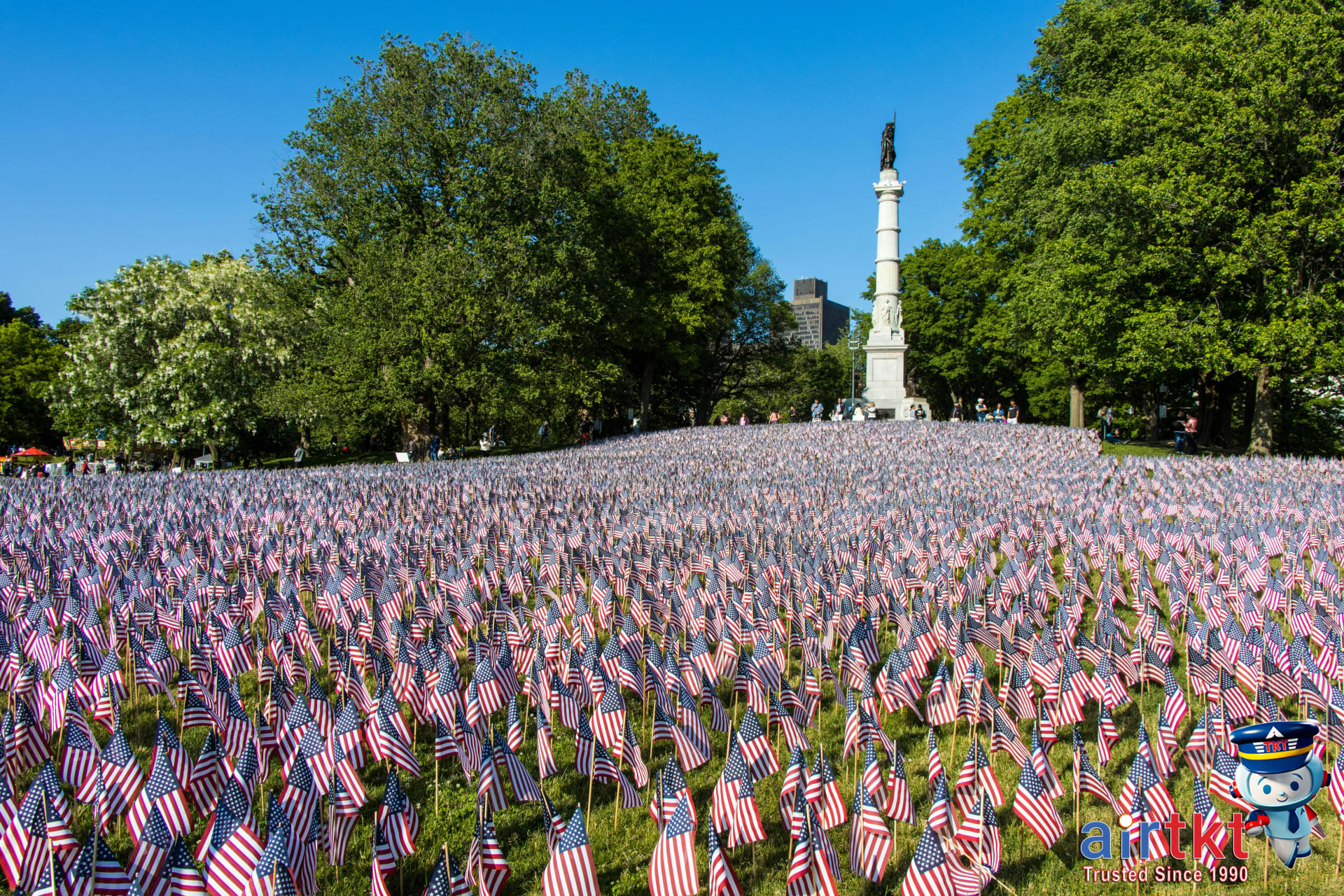 Family picnic at US monument during Flag Day road trip with children