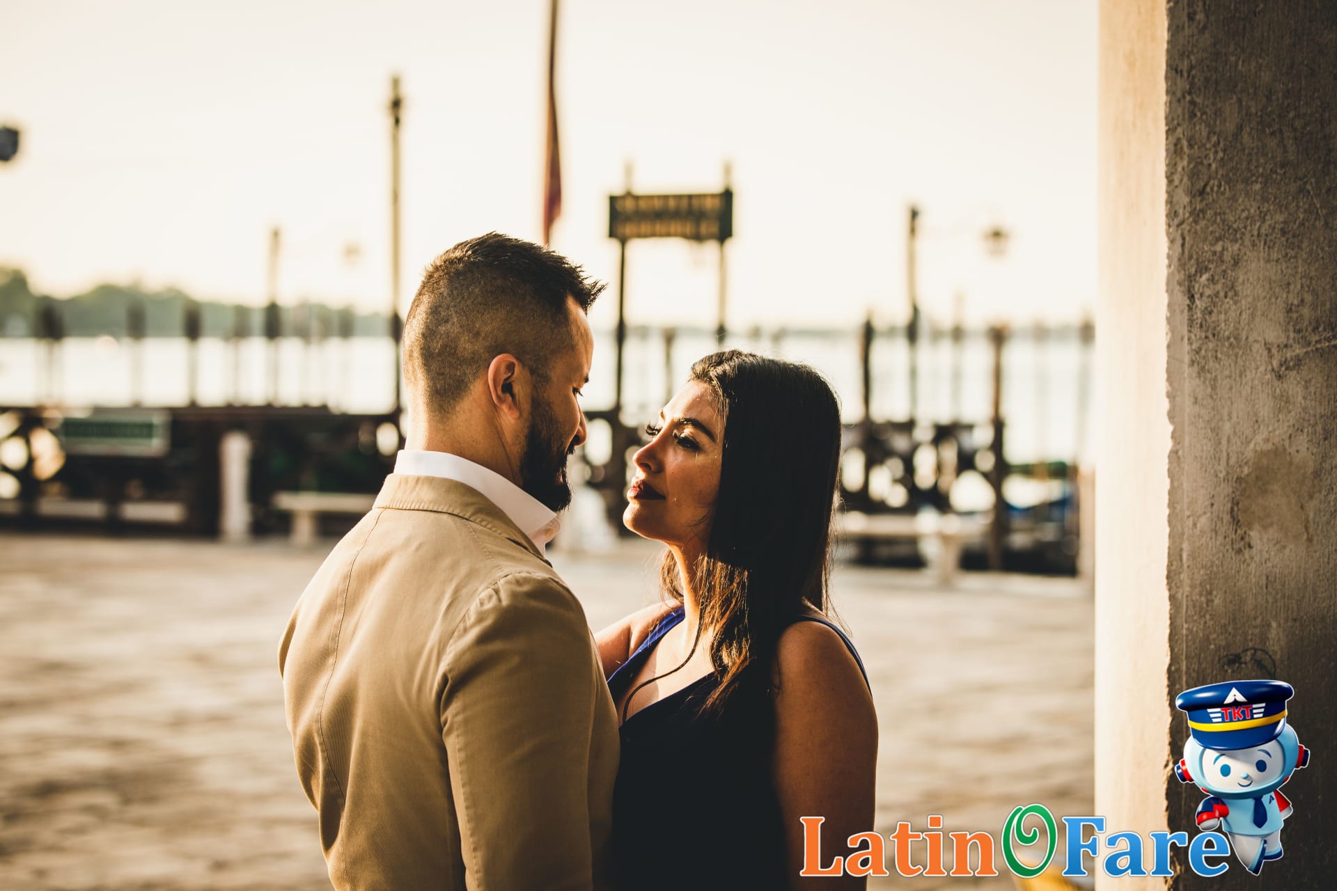Couple sharing gelato near Venetian canal on romantic budget trip, European affordable getaway.