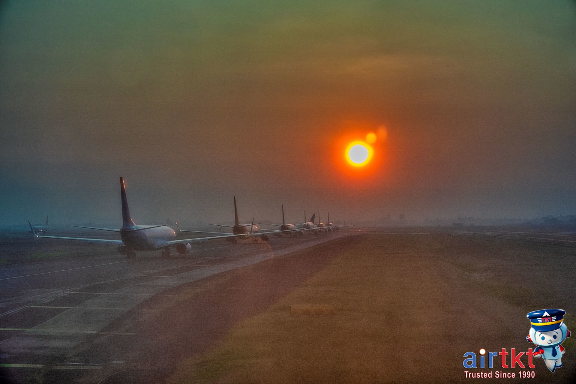 Airplane on the tarmac at sunset after a successful airport upgrade