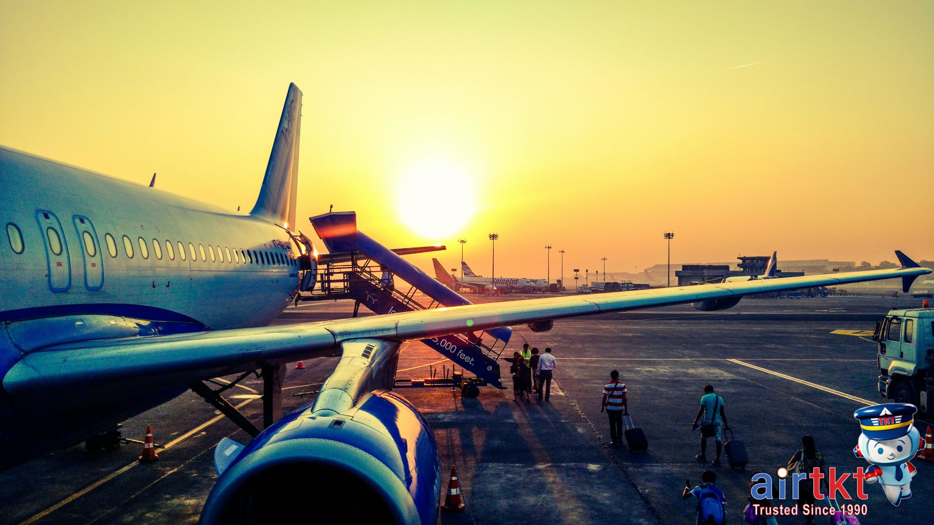 Family boarding plane at sunrise with children enjoying travel-saving airline deal
