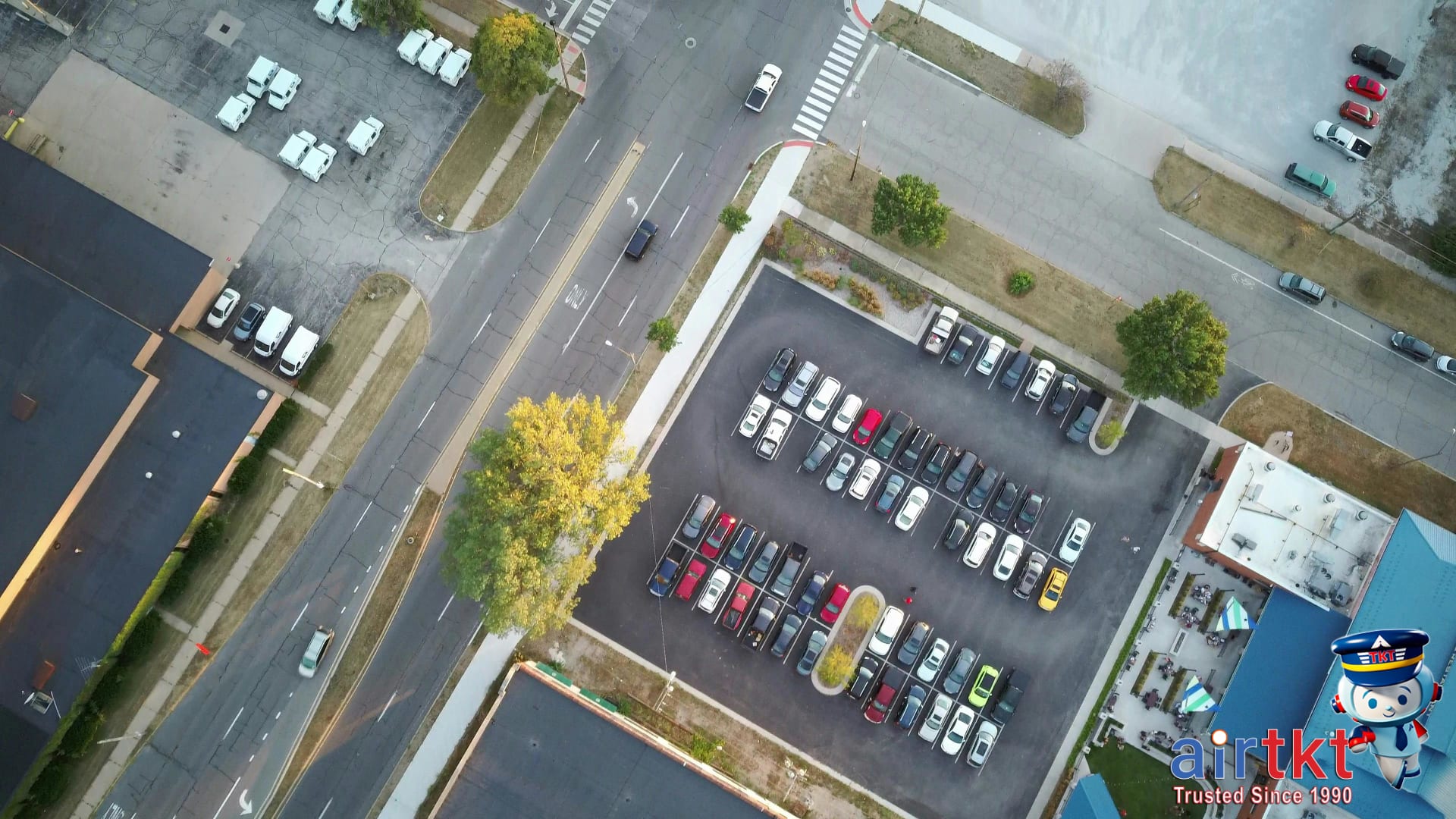 Drone shot of parking lot filled with rental cars representing insurance FAQs