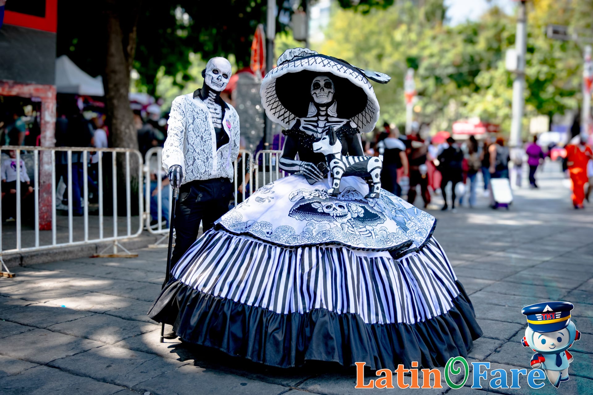 Mexico City Catrina parade with Day of the Dead costumes and skull makeup in festival crowd