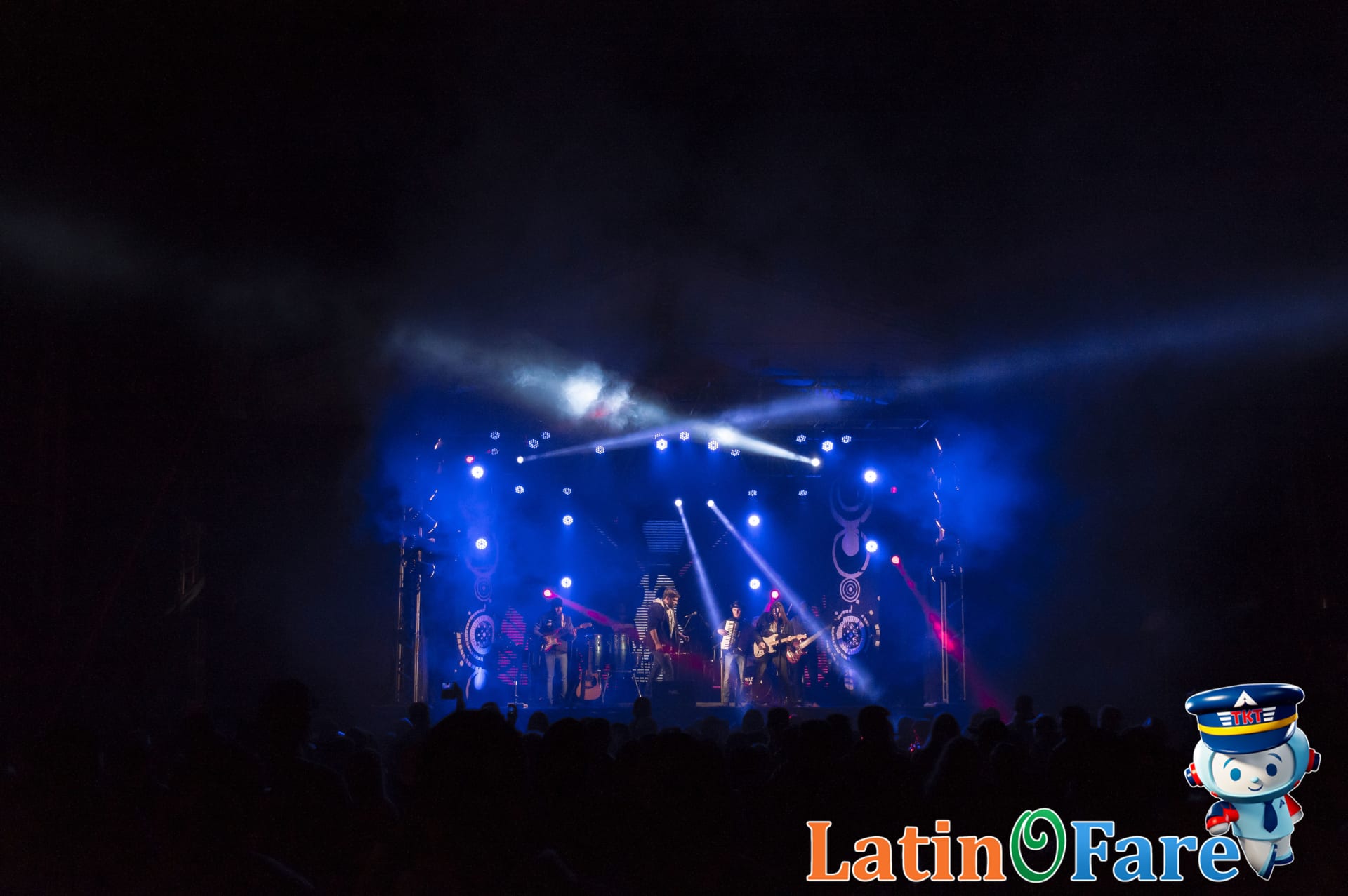 Live band performing on a main stage at Bonnaroo Music Festival in Tennessee