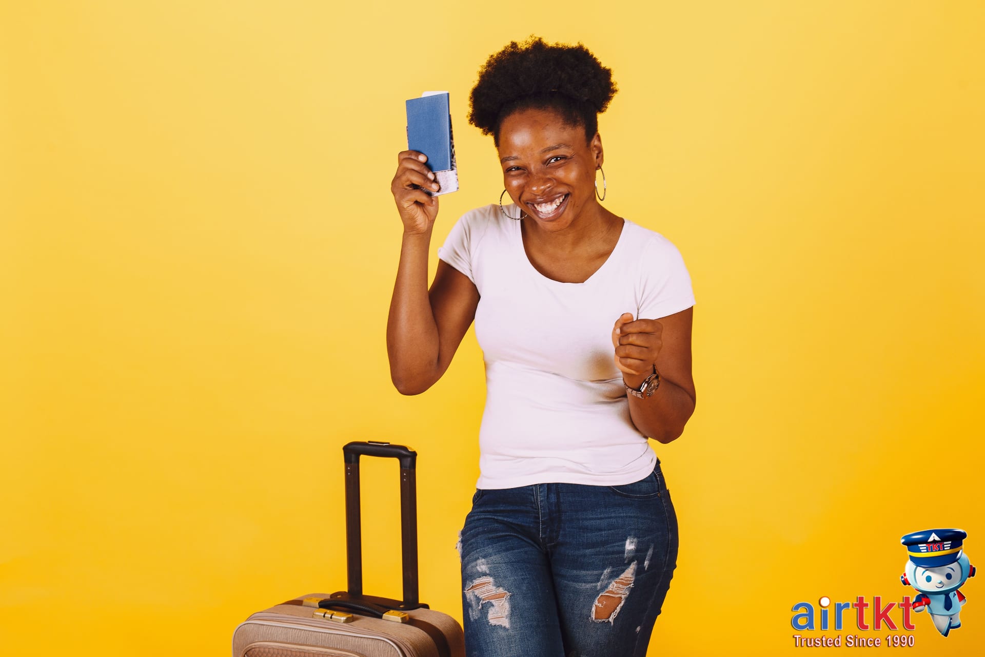 Happy traveler smiling while holding United Airlines boarding pass for MileagePlus program