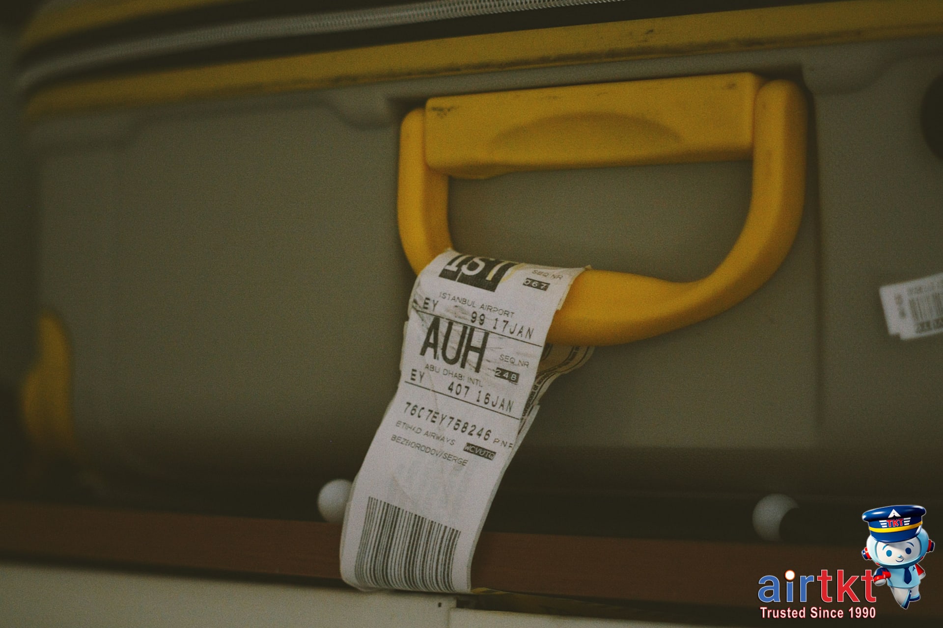 Traveler packing suitcase with United Airlines luggage tag for MileagePlus trip