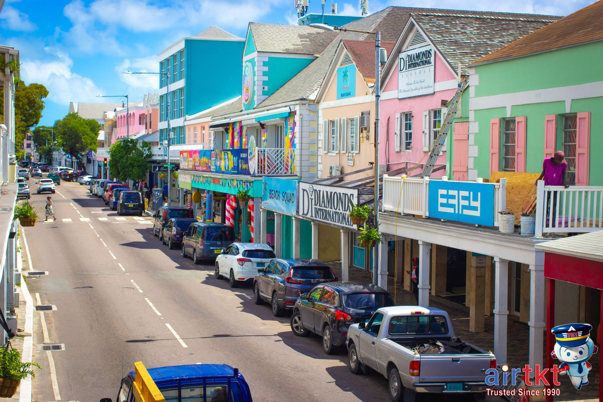 Colorful Bahamas street market with pastel buildings highlighting island culture and beach paradise.