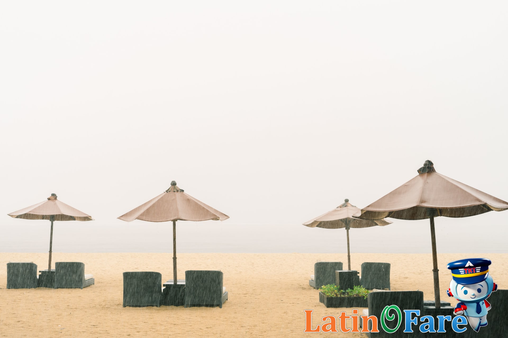 Quiet Caribbean resort with empty beach during hurricane season under cloudy sky.