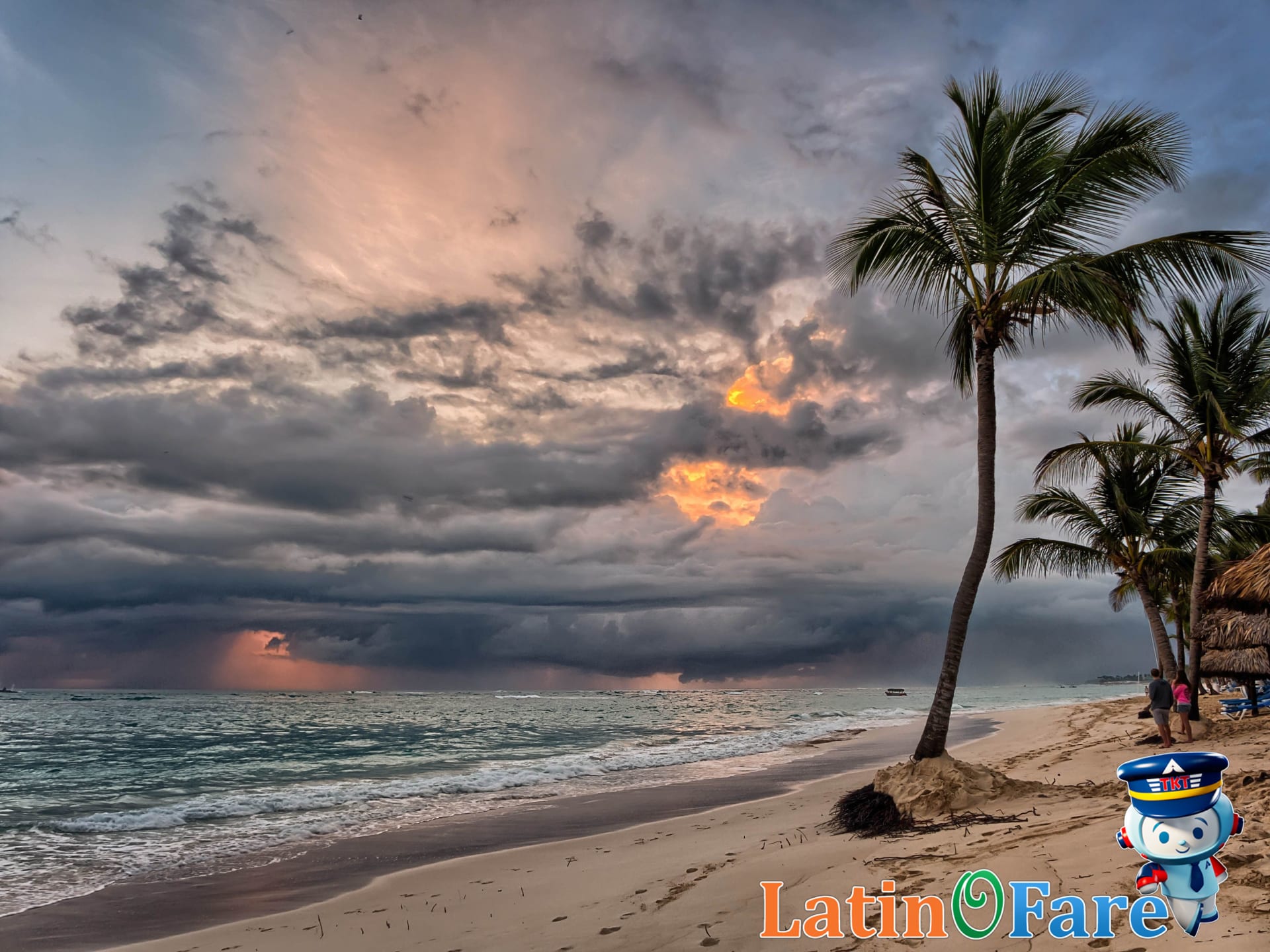 Caribbean beach during hurricane season with approaching storm clouds overhead