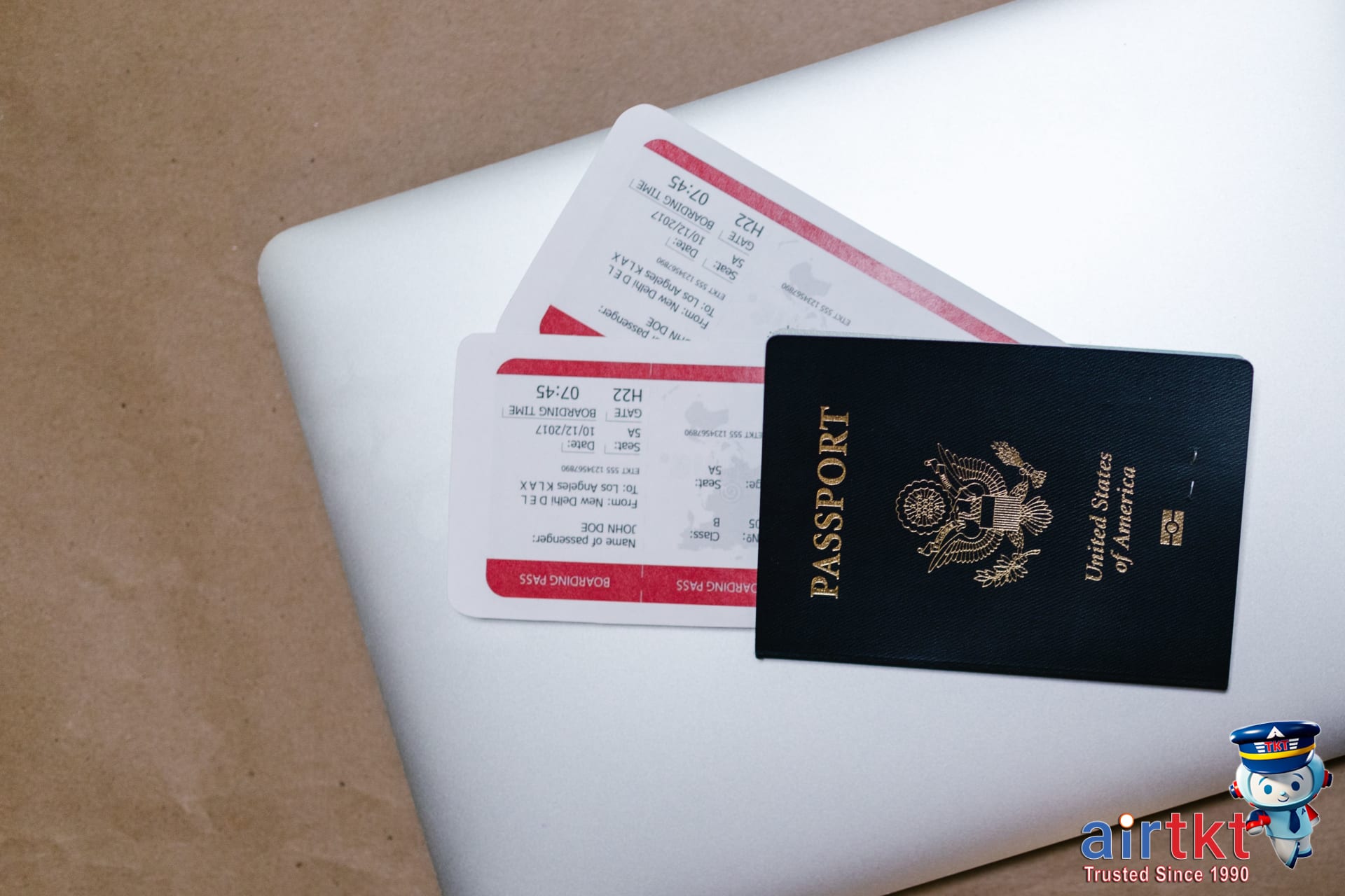 Booking affordable Fourth of July travel deals online using laptop
