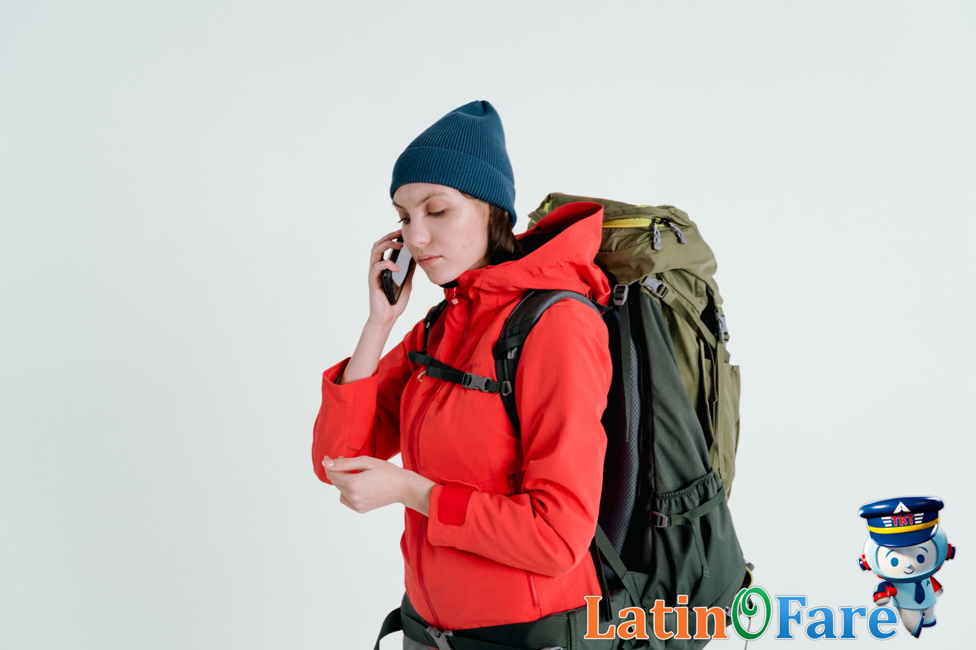 Backpacker reviewing gear checklist on phone before final camping trip packing