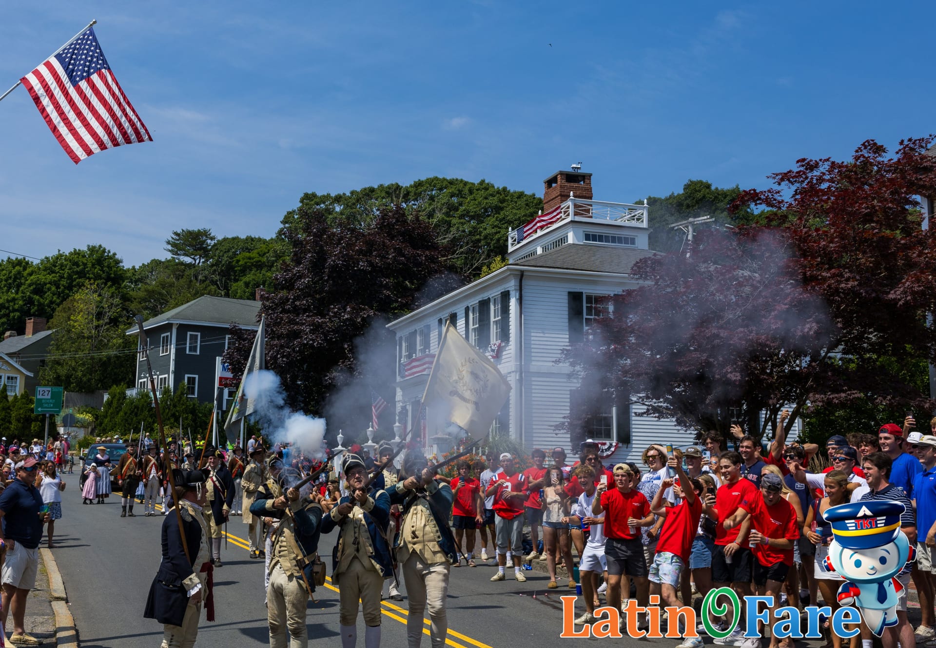 Independence Day parade crowds wave U.S. flags, a classic July 4th travel highlight.