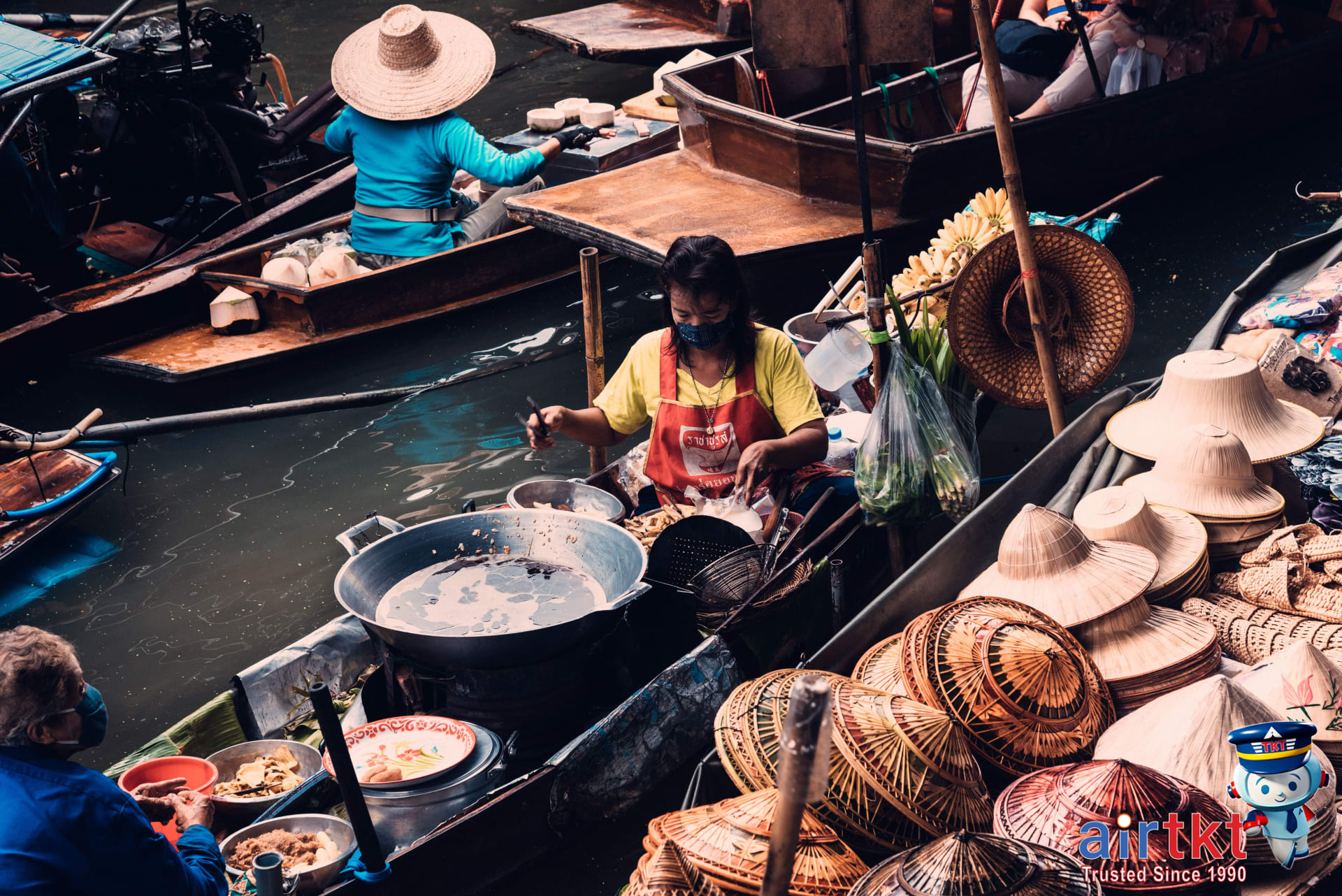Traditional local market near Chao Phraya river pier bustling with vendors