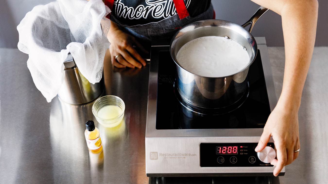 Amoretti Recipe: Homemade Ricotta. Simmer milk mixture.