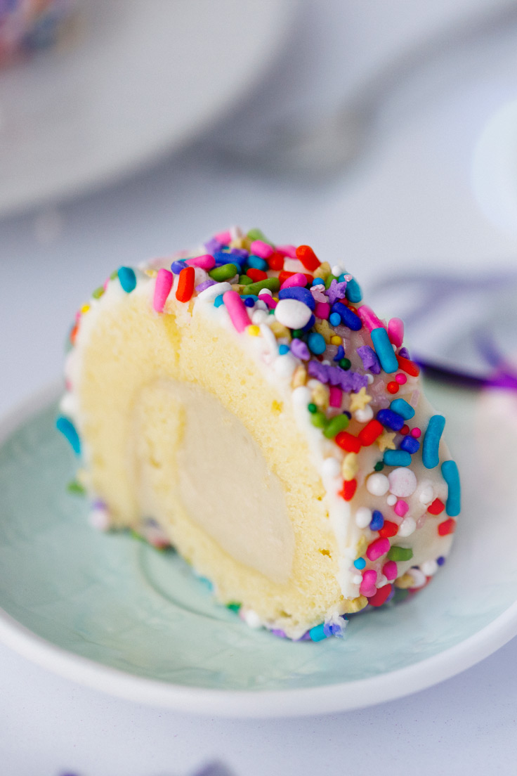 A slice of Amoretti's Mini Rainbow Roulades with Birthday Cake Filling Recipe