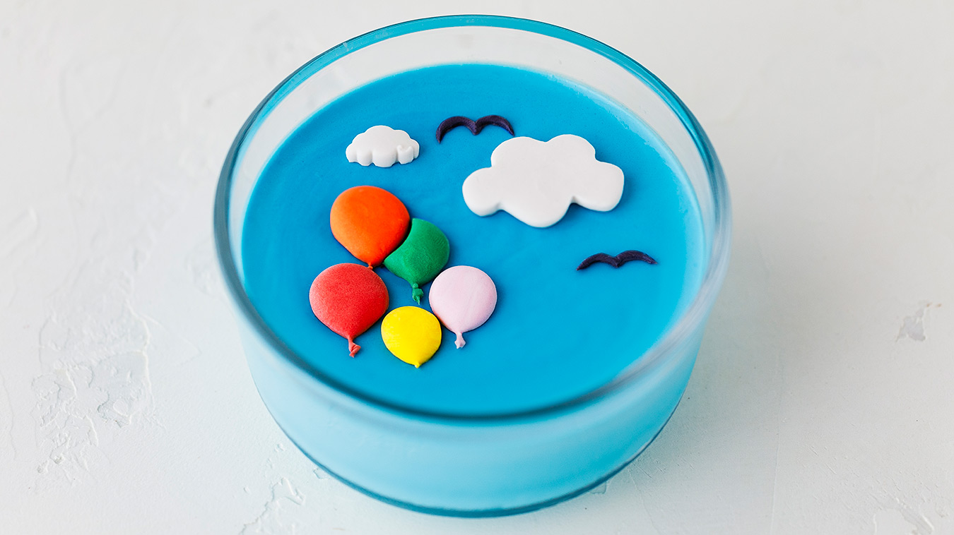 Amoretti Recipe: Coconut Blue Raspberry Panna Cotta decorated with balloons