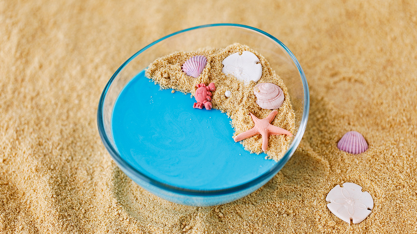 Amoretti Recipe: Coconut Blue Raspberry Panna Cotta decorated like a beach