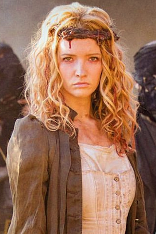 A blonde, dark-eyed woman wearing a crown of...are those fingerbones?