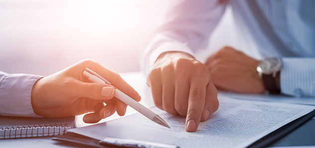 Two People Outlining a Document