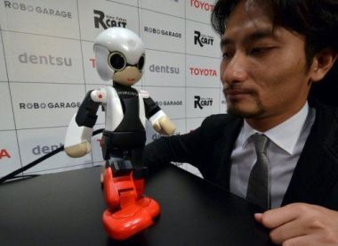 Tomotaka Takahashi demonstrates robot Kirobo in Tokyo. Tomotaka Takahashi demonstrates robot Kirobo in Tokyo.