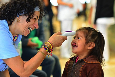 Victoria Leal laughs with a patient