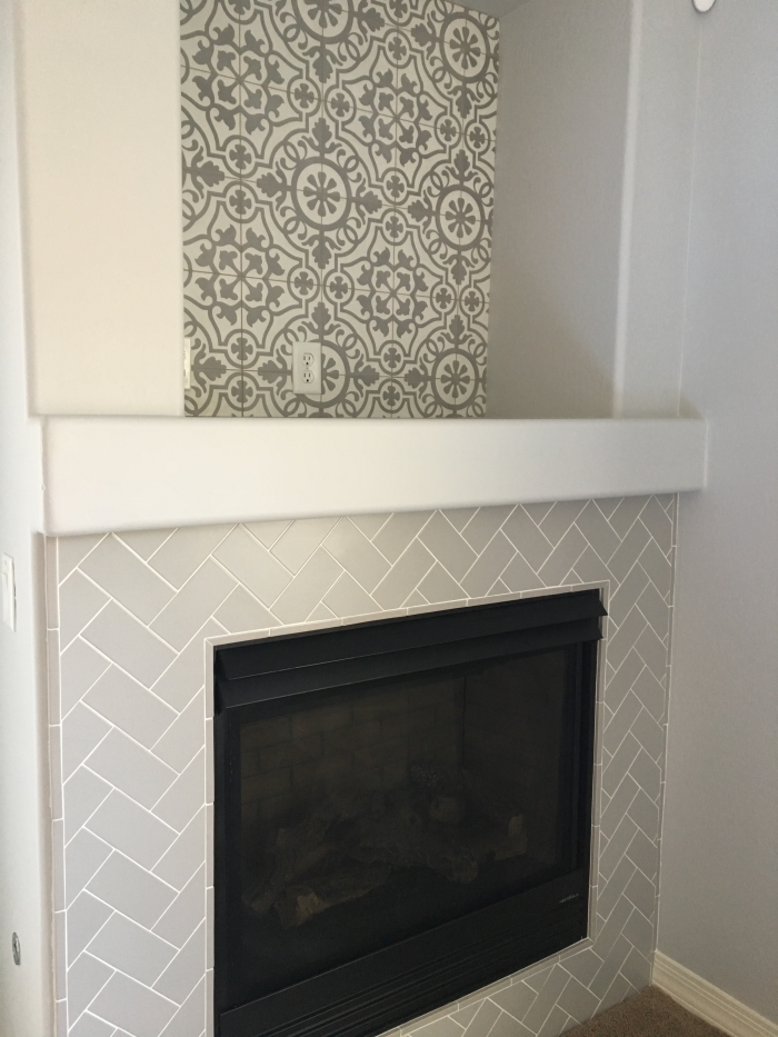 Remy 8x8 cement tile in Damsel and Costa Allegra 3x6 ceramic tile in Cinder on fireplace