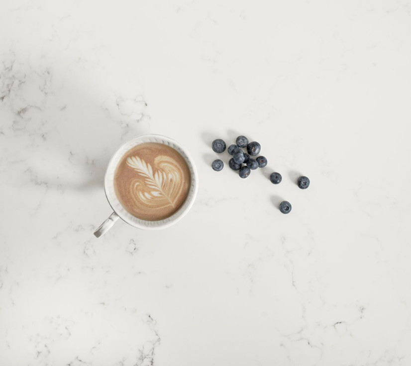 Coffee and blueberries on counter