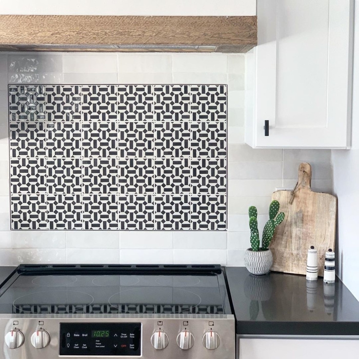 Design a graphic backsplash for visual effect in your white kitchen