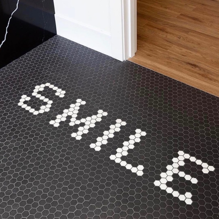 You are sure to make your guests smile with this combination of black and white hexagon mosaic tiles