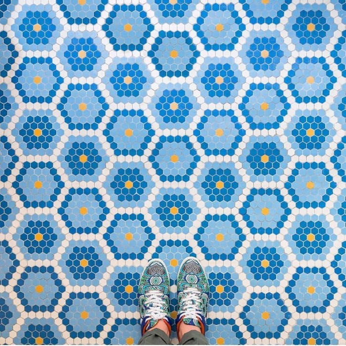 Contrasting blue and orange in the tile and shoes!