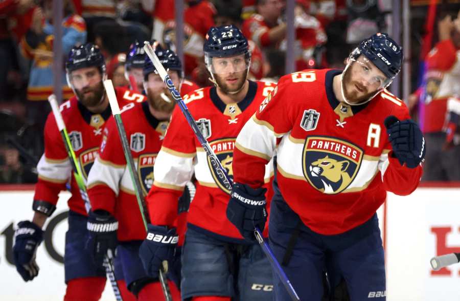 Buffalo Sabres center Tage Thompson, center, celebrates after scoring  against the New Jersey Devils during the first period of an NHL hockey game  in Buffalo, N.Y., Friday, March 24, 2023. (AP Photo/Adrian