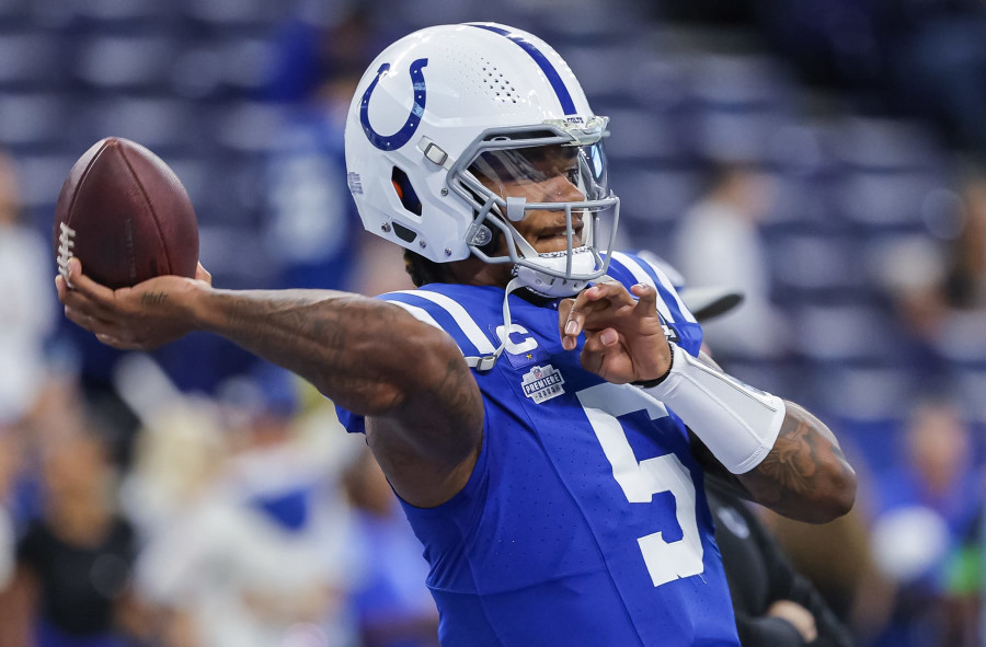 Baltimore Ravens wide receiver Jaylon Moore runs the ball against Tennessee  Titans cornerback Tre Swilling (20) during the second half of a NFL  preseason football game, Thursday, Aug 11, 2022, in Baltimore. (