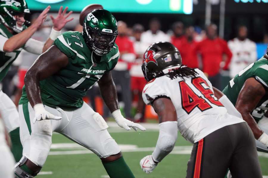 Philadelphia Eagles running back Jason Huntley (32) and quarterback Carson  Strong (8) greet each other as they warm up before the start of a NFL  preseason football game against the Miami Dolphins