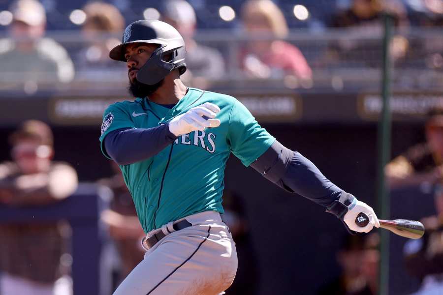 Cleveland Guardians' Owen Miller, right, scores in front of Tampa Bay Rays  first baseman Christian Bethancourt on an RBI double by Andres Gimenez off  Tampa Bay Rays starting pitcher Jeffrey Springs during