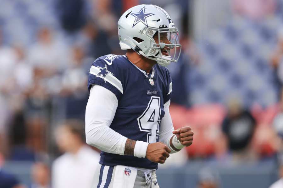 Los Angeles Chargers quarterback Justin Herbert (10) adjusts his helmet as  he warms up before an NFL football game against the Seattle Seahawks Sunday,  Oct. 23, 2022, in Inglewood, Calif. (AP Photo/Marcio