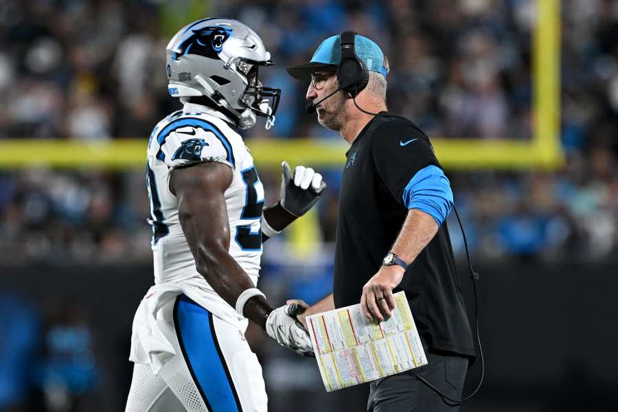 Carolina Panthers defensive end Marquis Haynes (98) and New England  Patriots defensive back A.J. Moore (33) during the preseason NFL football  game between the New England Patriots and the Carolina Panthers on