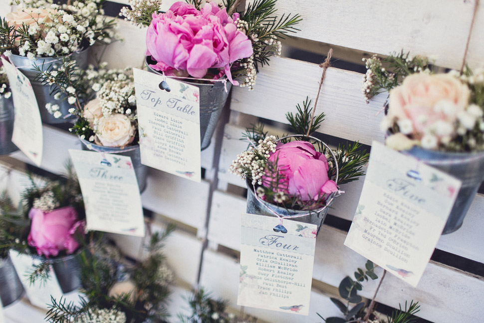 Bridebook.co.uk- seating plan with pots of flowers