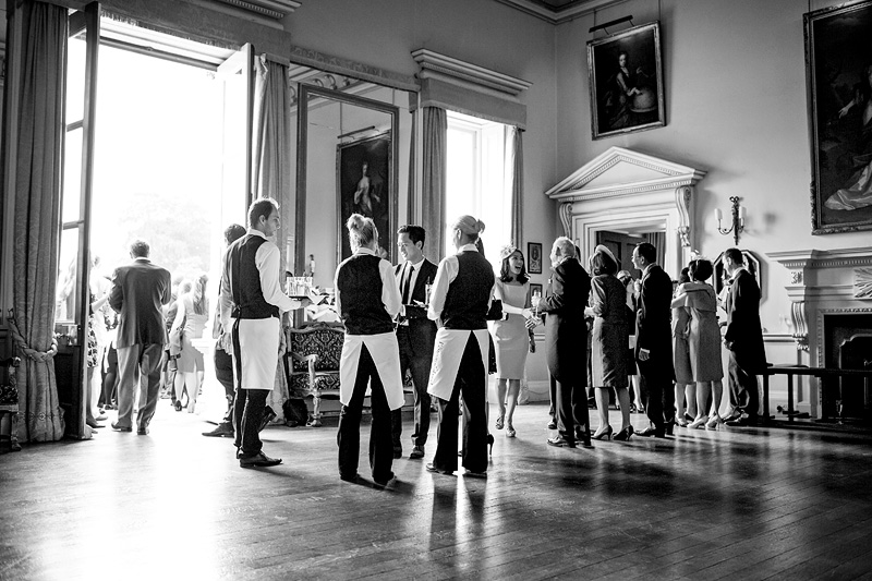 Bridebook.co.uk- guests being greeted by wedding party and champagne