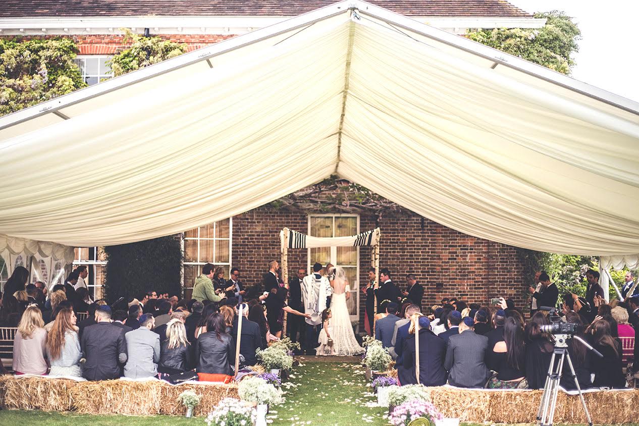 bridebook.co.uk-smashing-the-glass-rustic jewish wedding ceremony